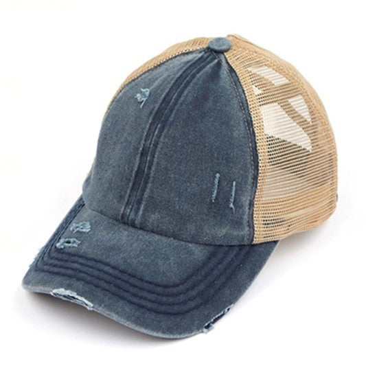 Lightly distressed navy blue ponytail hat beige netting 