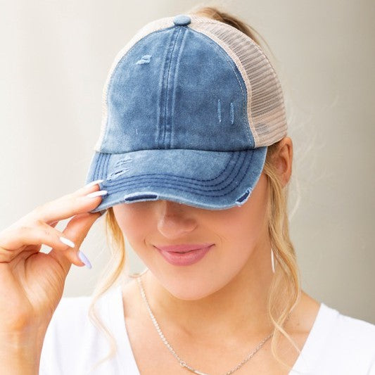 Lightly distressed blue ponytail hat beige netting 